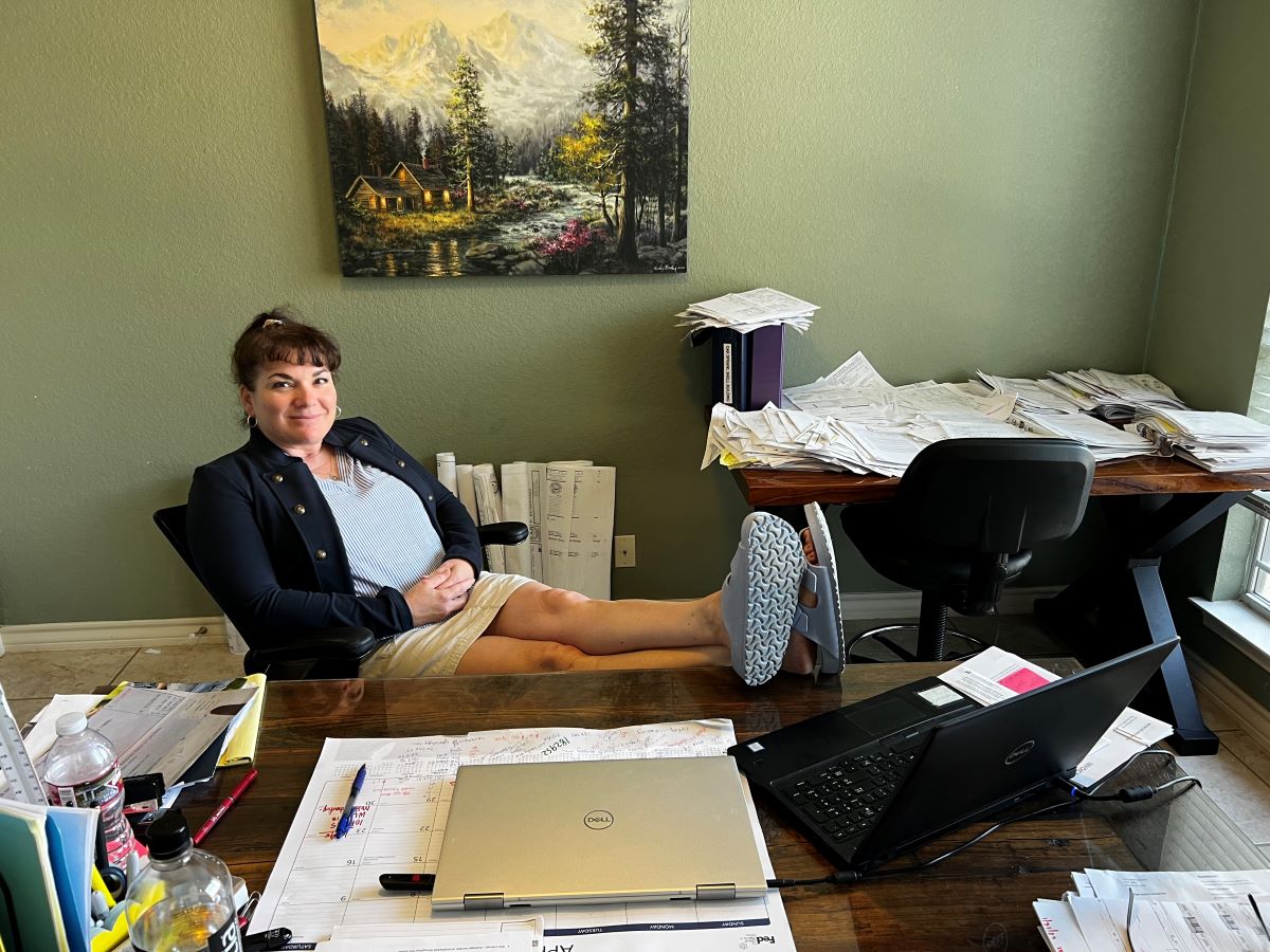 Misty at her 'legendary' home office desk with her feet up.